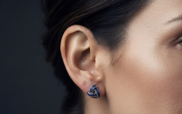 Blue CZ Knot Stud Earrings For Women's Wear In 925 Sterling Silver