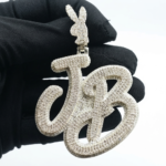Tester Passing Moissanite "JB" Pendant In 925 Sterling Silver.