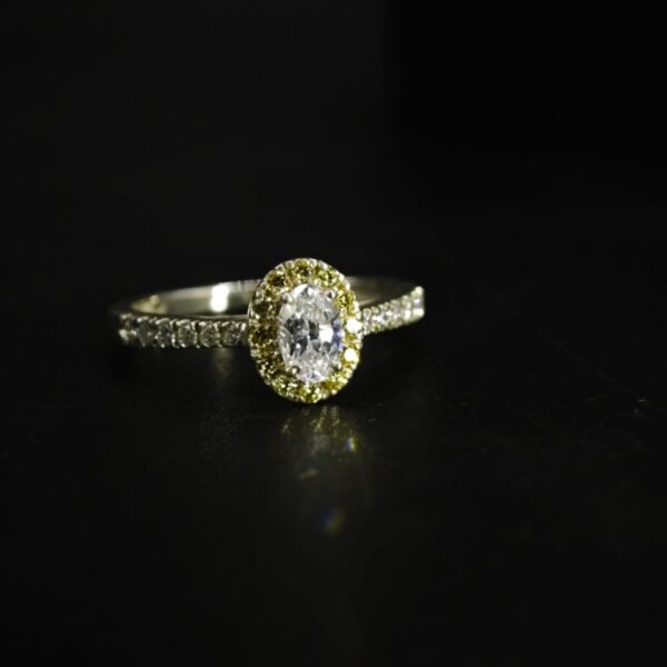 Oval Cut White and Yellow CZ Halo Ring